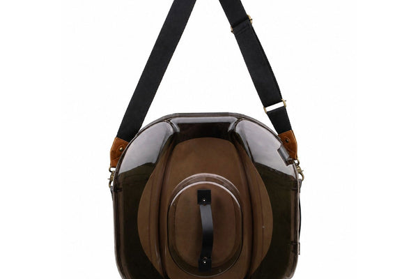 A Better Hat Can with a brown felt cowboy hat visible through the smoke-tinted lid and the black shoulder strap attached