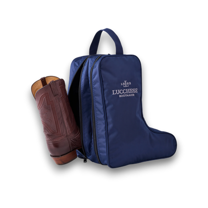 Moon Ridge Hats and Heritage blue nylon Lucchese boot bag with a brown leather cowboy boot partially inside