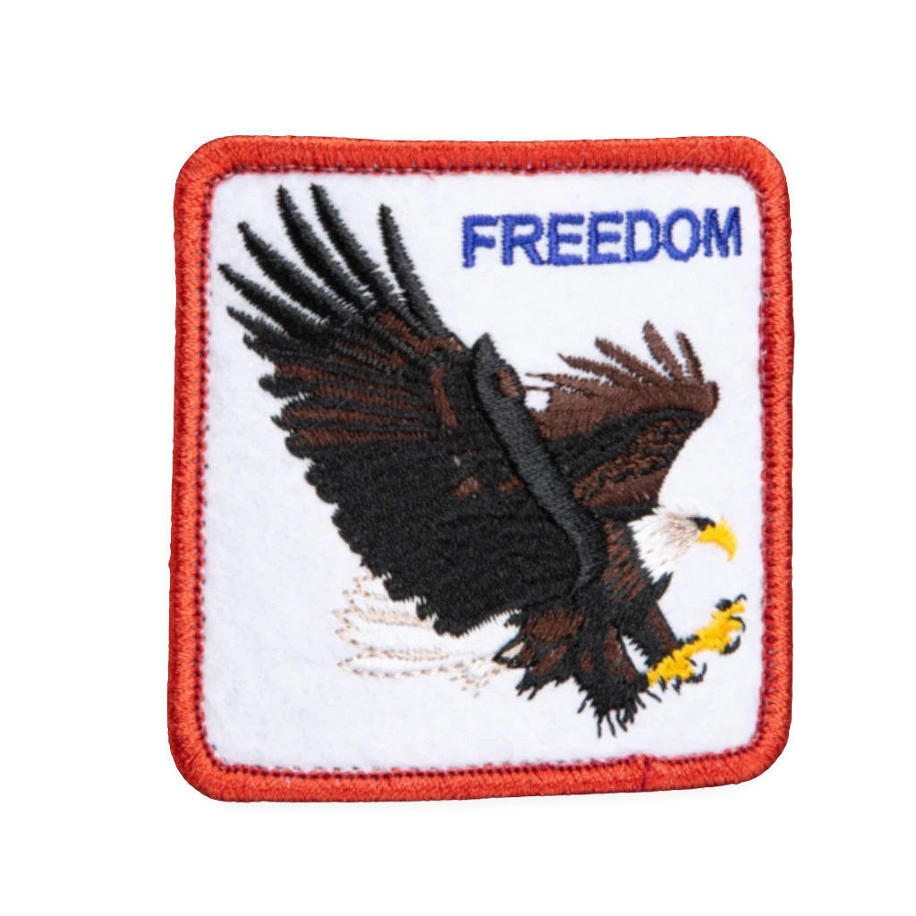 Moon Ridge Hats and Heritage Goorin Bros Freedom Eagle patch with embroidered eagle and "FREEDOM" text on white background with red border.