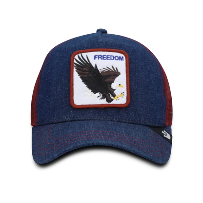 Moon Ridge Hats and Heritage navy denim trucker hat with red mesh back and embroidered eagle patch with "FREEDOM" text.