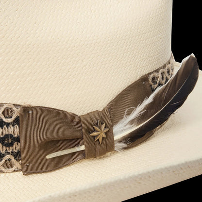Moon Ridge Hats and Heritage Lonetree straw hat with brown ribbon, star pin, and feather detail.