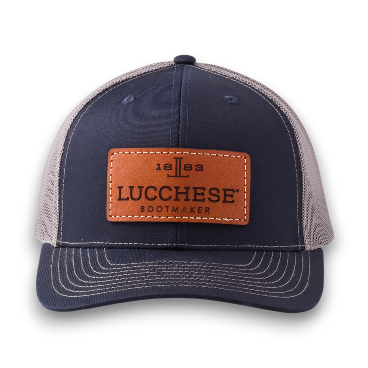 Moon Ridge Hats and Heritage Lucchese navy and charcoal trucker cap with a brown leather logo patch and mesh back