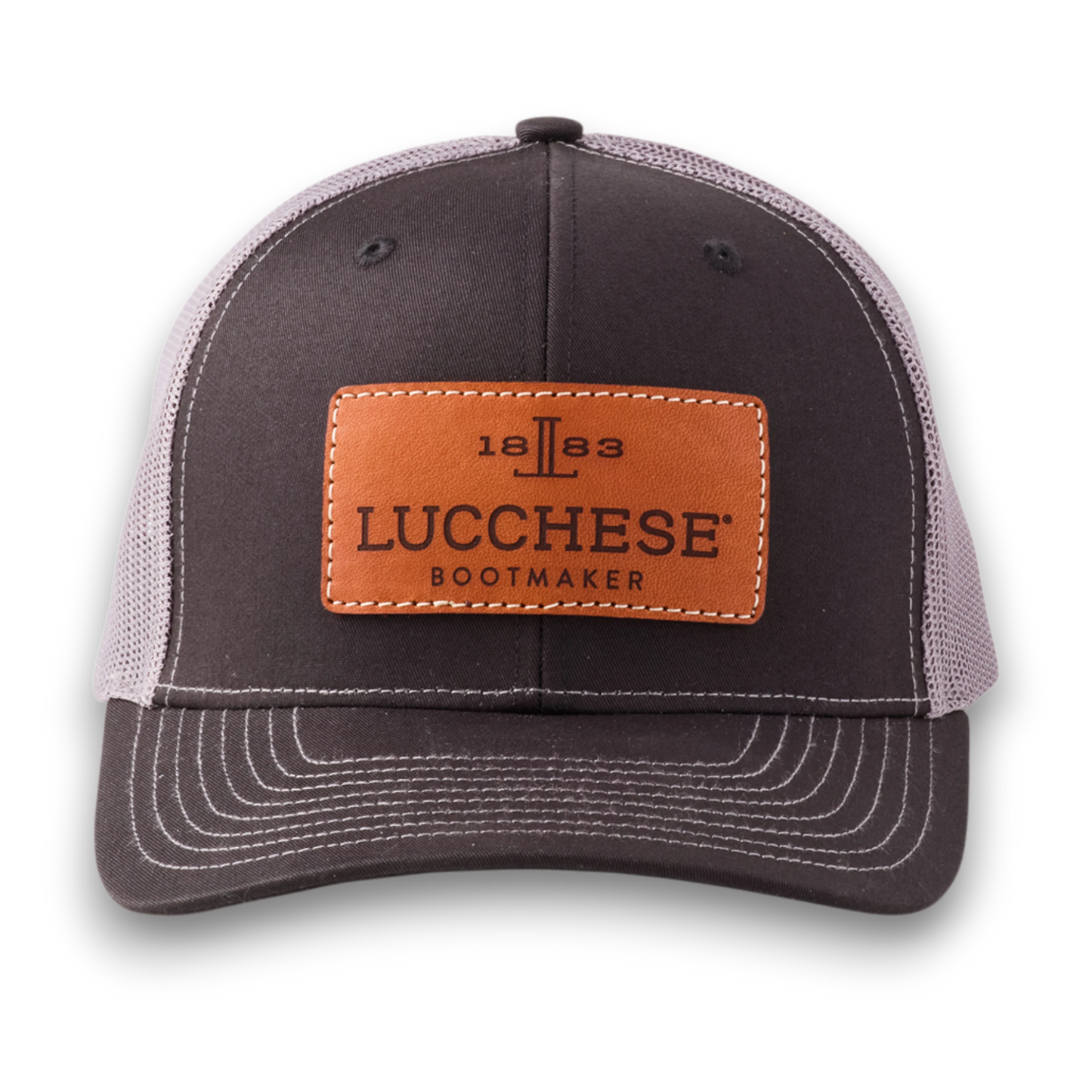 Moon Ridge Hats and Heritage Lucchese black and charcoal mesh trucker cap with a tan leather logo patch