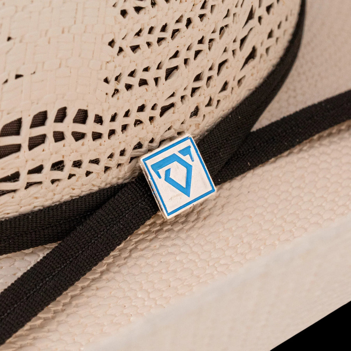 Moon Ridge Hats and Heritage Resistol Cojo Vaquero straw cowboy hat with a chocolate brown ribbon and Cojo logo pin