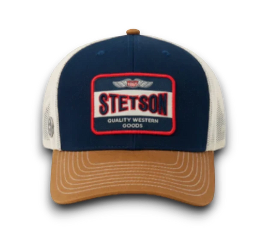 Moon Ridge Hats and Heritage Stetson trucker cap with blue front, white mesh back, and tan brim. Features embroidered Western Wear patch.