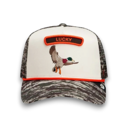 Moon Ridge Hats and Heritage tan trucker hat featuring a brown doodle dog patch with a blue border and mesh back