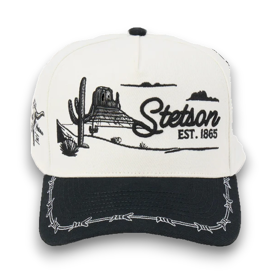 Rafter M Hat Company Stetson trucker hat with embroidered desert landscape, cacti, mesas, and barbed wire brim. White and black.