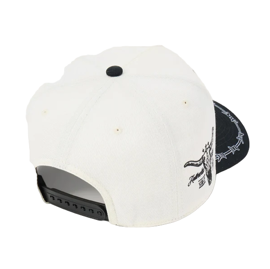 Rafter M Hat Company cream trucker hat with black brim, barbed wire detail, and bull skull embroidery. Adjustable snapback.