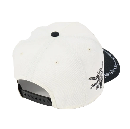 Rafter M Hat Company cream trucker hat with black brim, barbed wire detail, and bull skull embroidery. Adjustable snapback. alternate view
